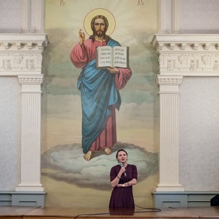 Логотип @evgeniya_e_zh - Woman in Church