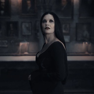 Логотип @morticiiaddams - Morticia Addams.