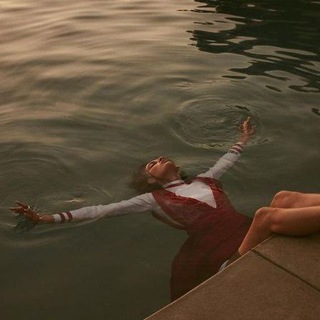 Логотип @poignantdarusia - Гірка Даруся